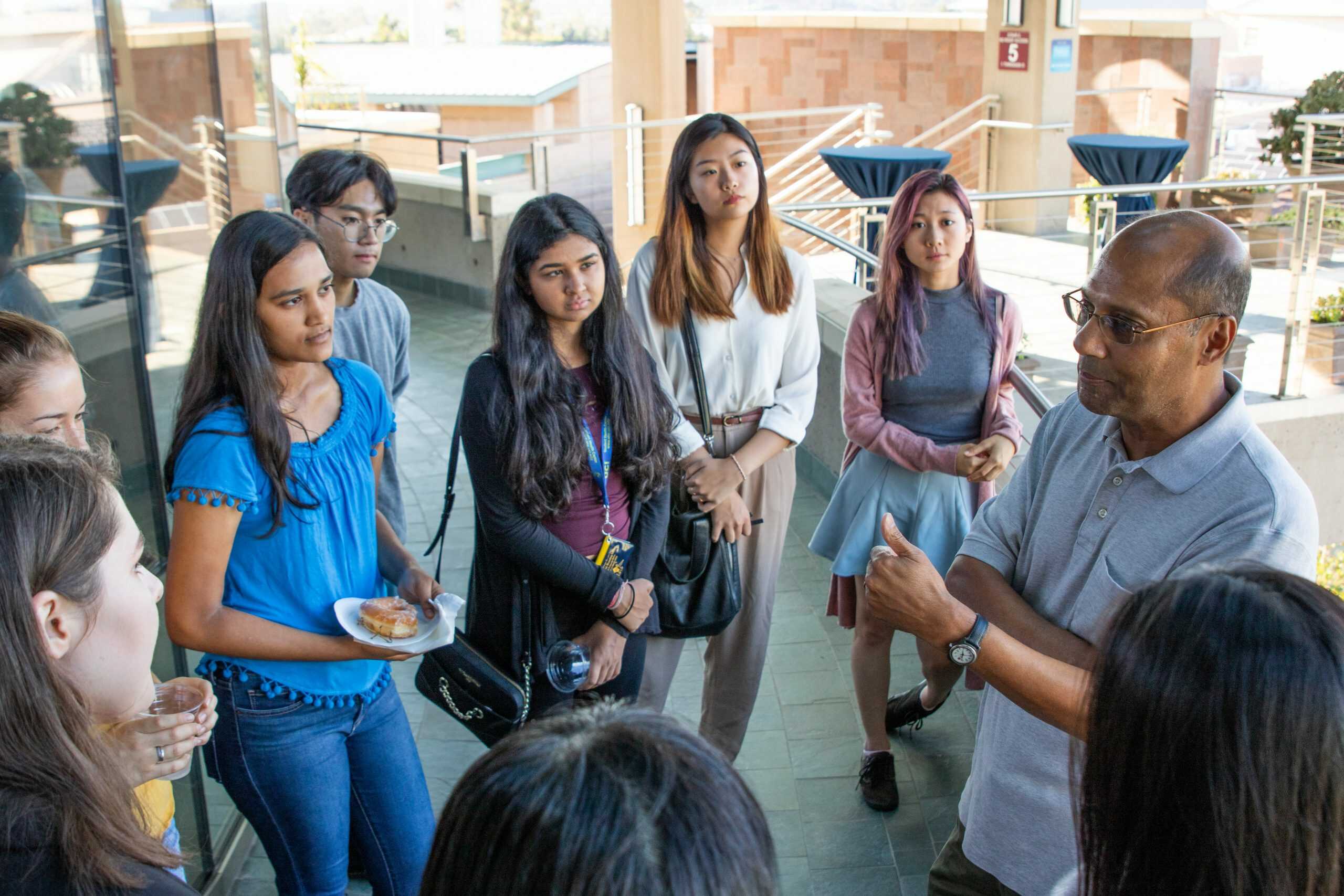 Associate Dean talking with students